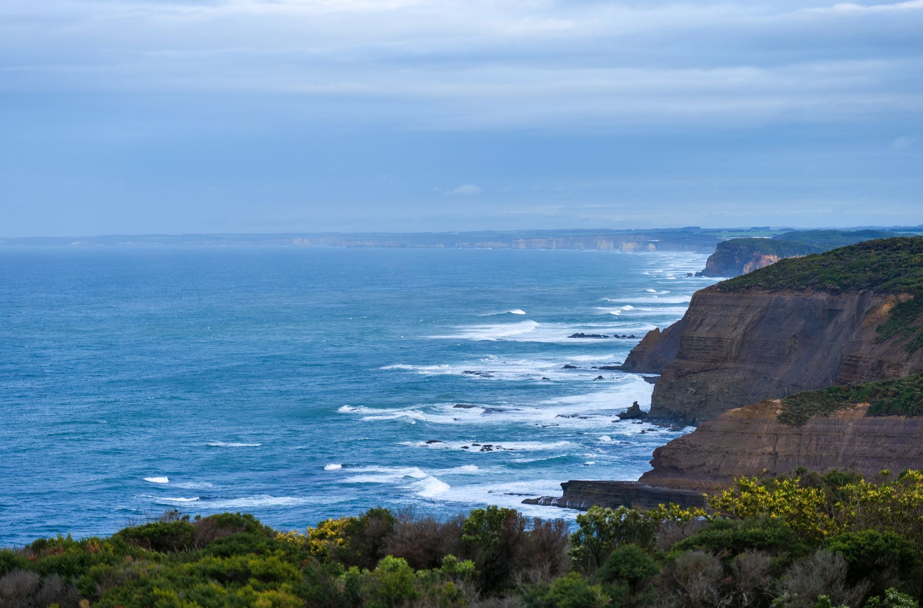 Great Ocean Road coastal cliffs and ocean along the sealed coastal route in Victoria, Australia