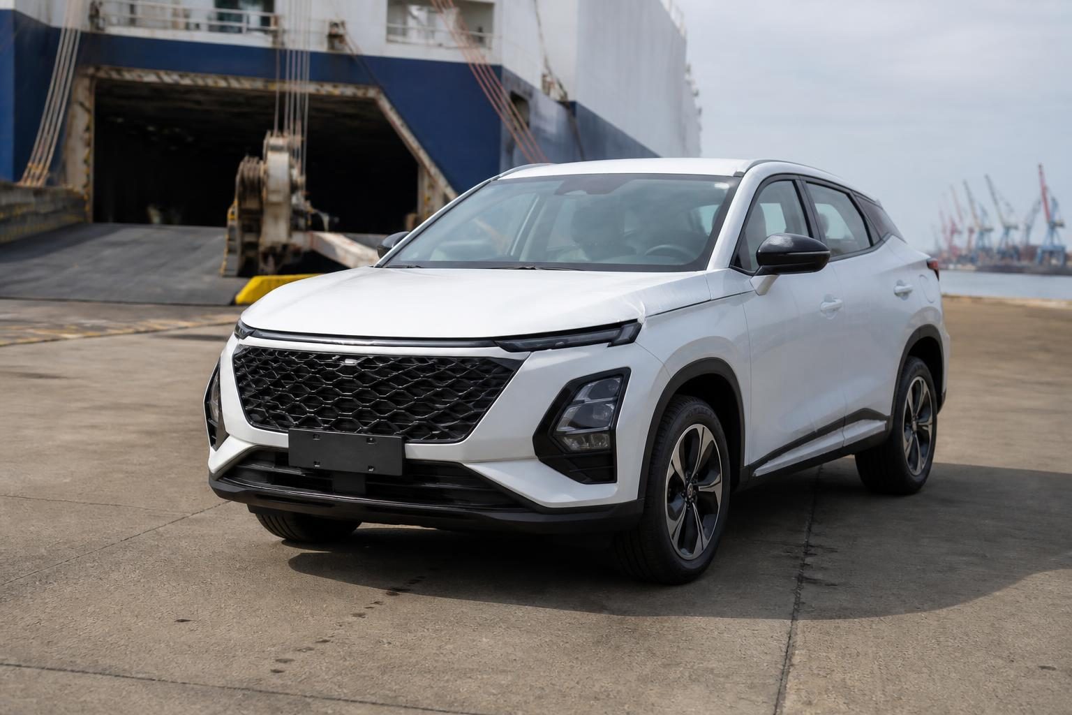 White SUV parked at a ship loading ramp on an industrial port dock.