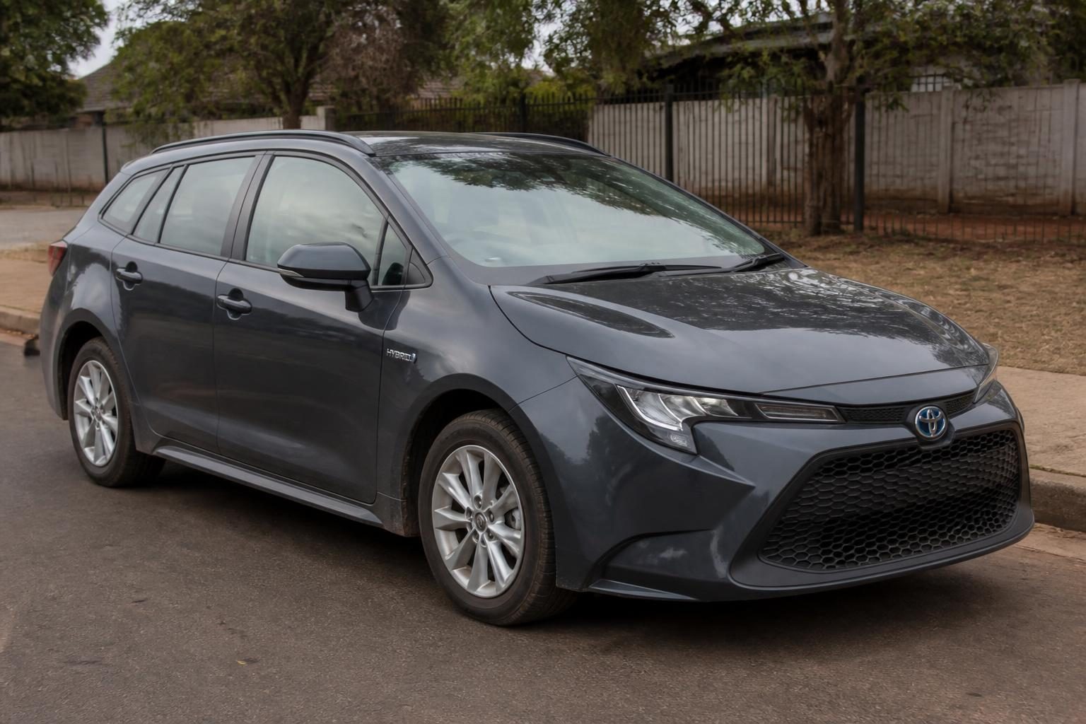 2021 Toyota Corolla Hybrid travelling on a paved road in Zimbabwe.