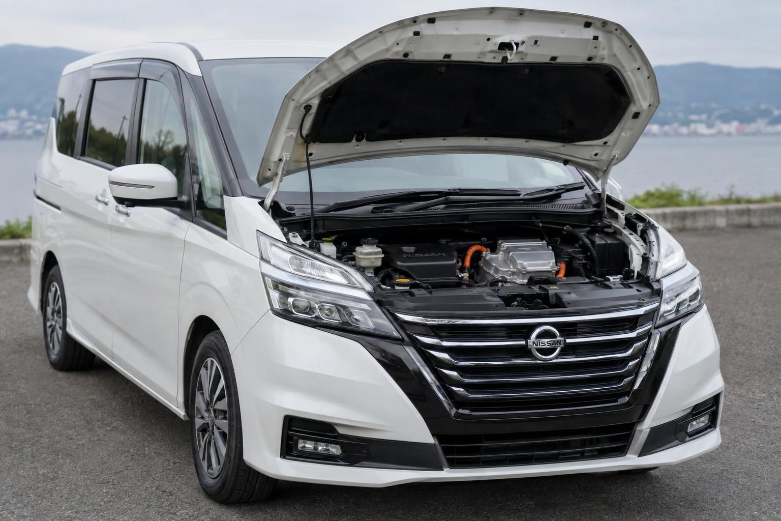 Engine bay of a Japanese people mover showing a four-cylinder petrol engine with a compact belt-driven motor generator unit.