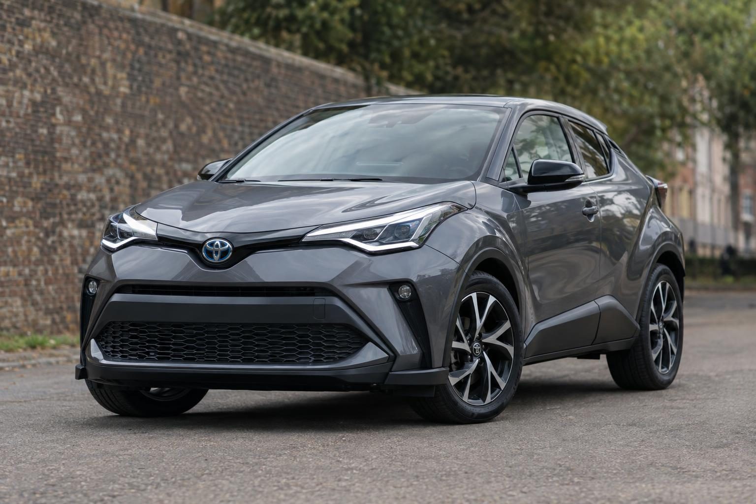 Grey Toyota C-HR shown from the front quarter on a street.