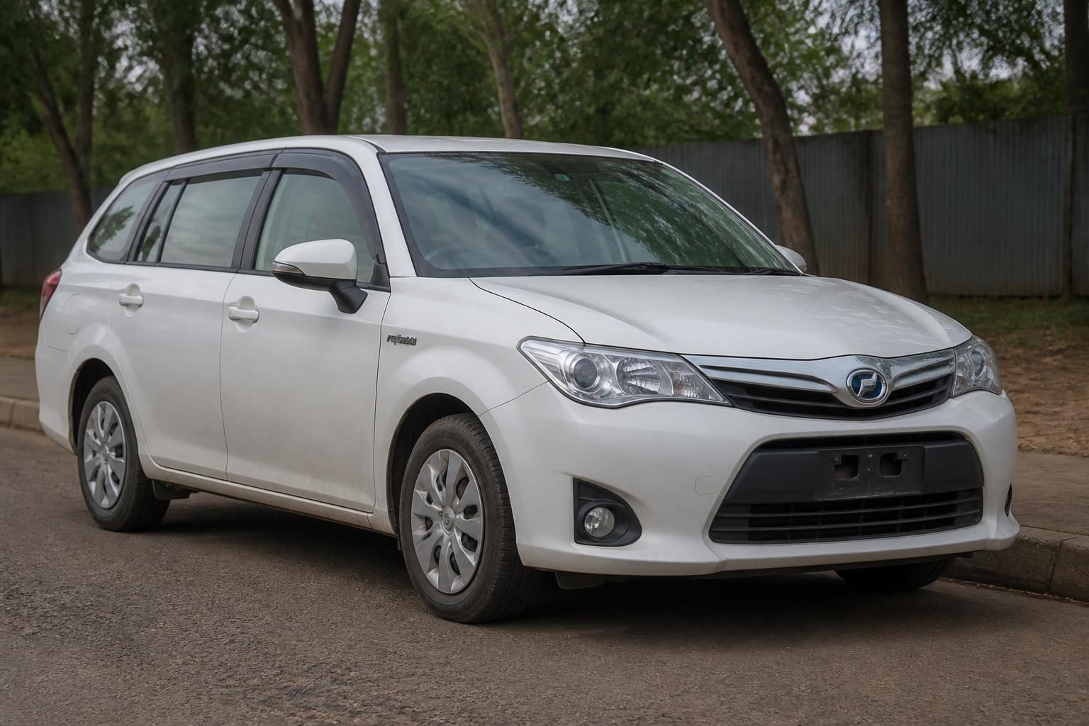 White 2014 Toyota Corolla Fielder Hybrid wagon viewed from the front